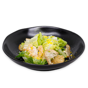 Caesar Salad on a black plate